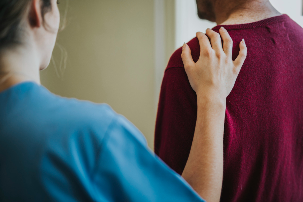 Female touching a mans shoulder